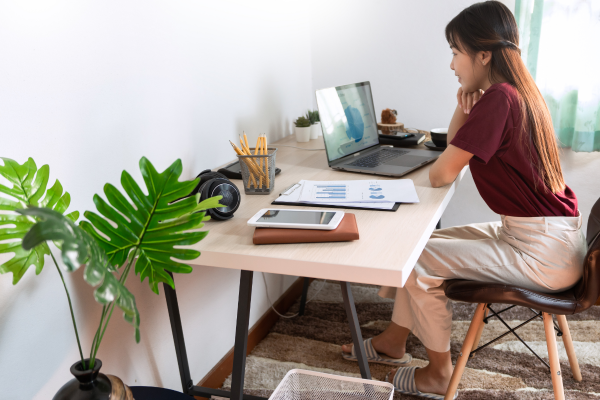 Supporting image of woman working from home
